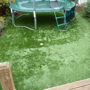a picture of some poor quality artificial grass that has flattened with use